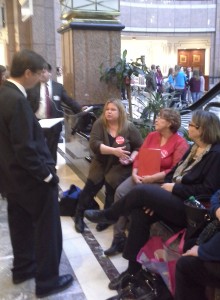 Rep. Mike Demicco, a member of the Public Health Committee, takes time to listen to the concerns of families